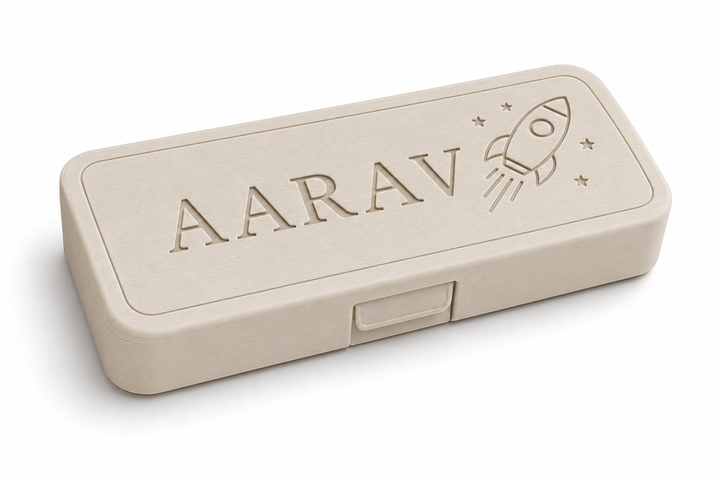 Angled view of a cream personalised Aarav pencil box with rocket engraving