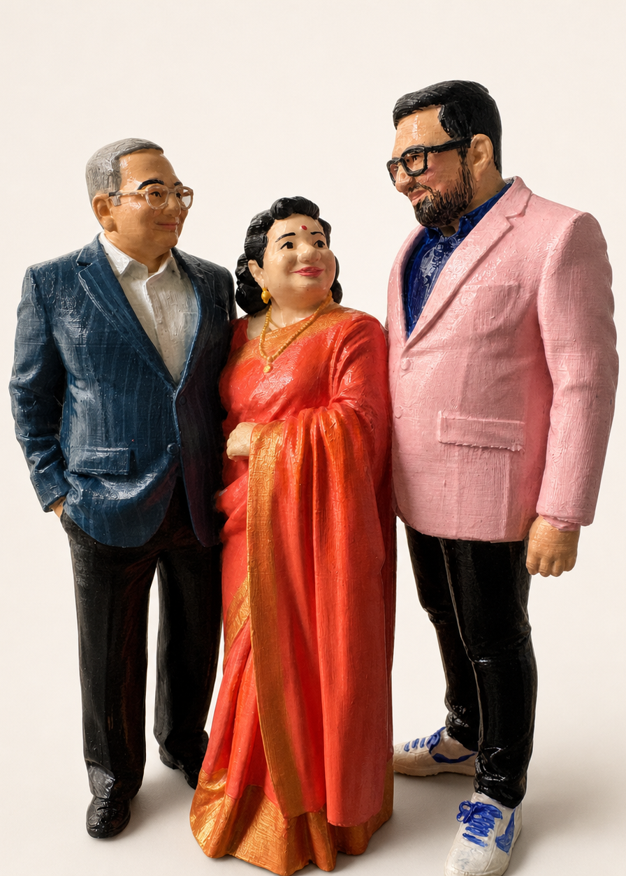 Personalised hand-painted three-person 3D portrait sculpture on a warm studio background