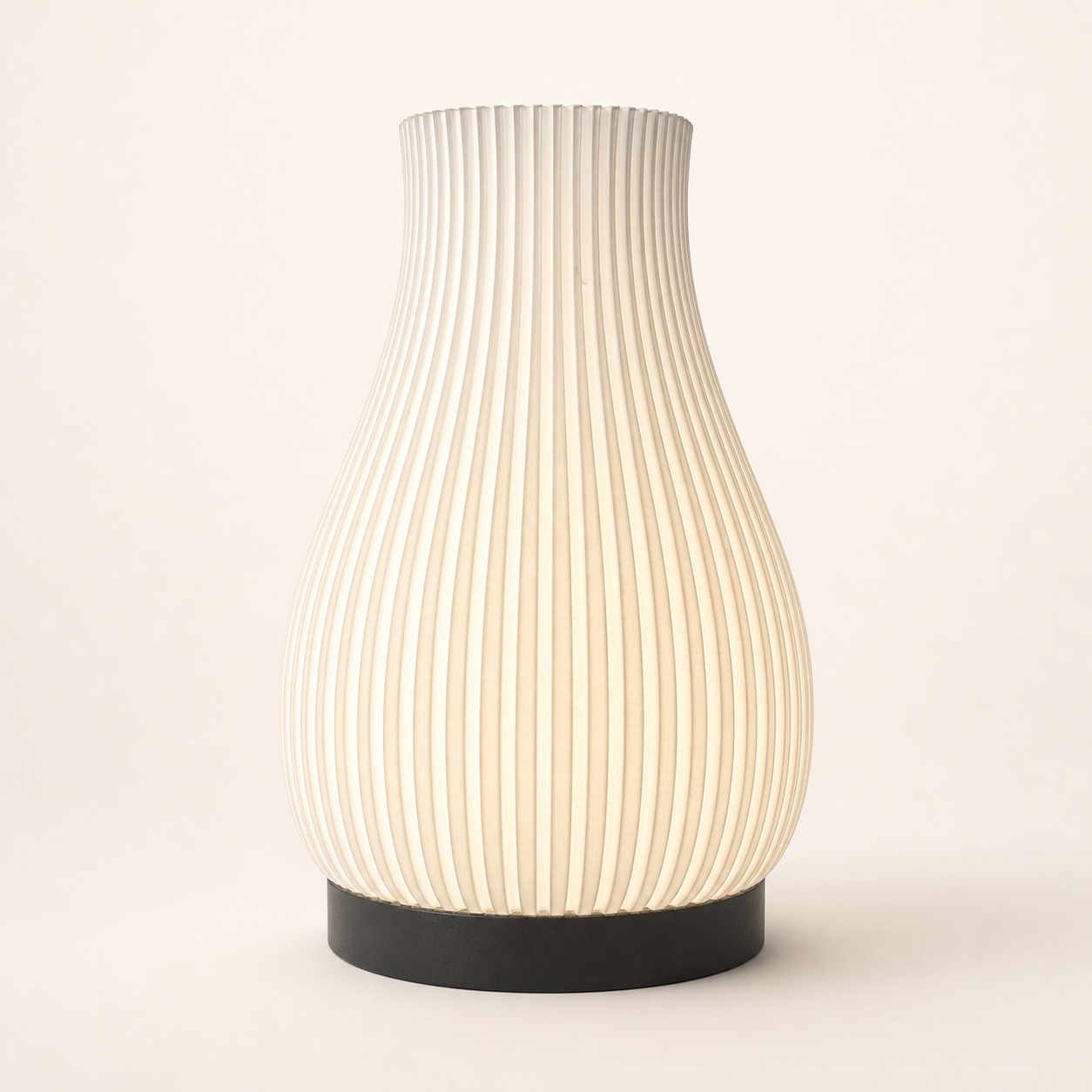 White ribbed 3D printed ambient table lamp on a warm studio background